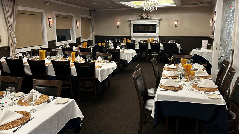 Banquet room with set tables with white table cloth