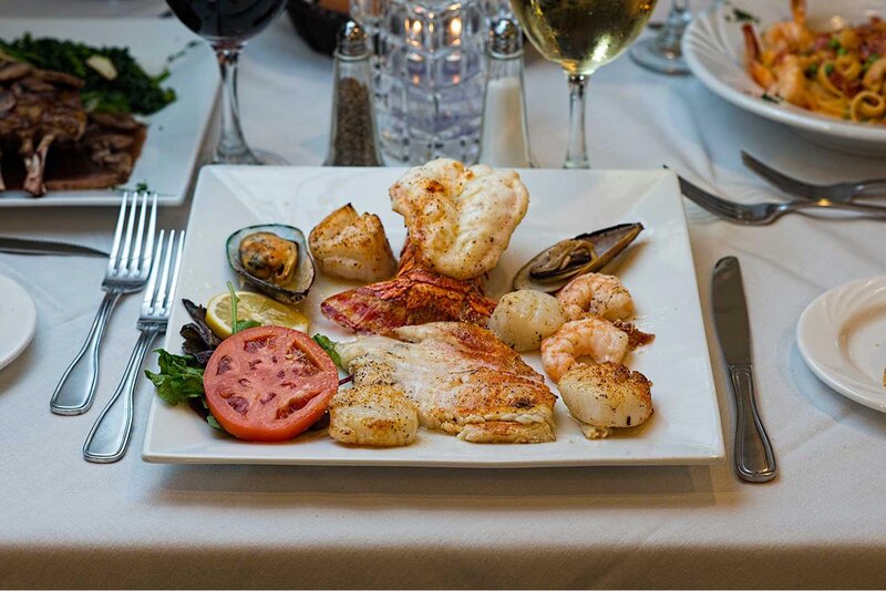 Seafood entree with lobster tail, shrimp, scallops and clams